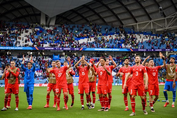 epa10324653 Swiss players applaud their fans after winning the FIFA World Cup 2022 group G soccer match between Switzerland and Cameroon at Al Janoub Stadium in Al Wakrah, Qatar, 24 November 2022. EPA ...