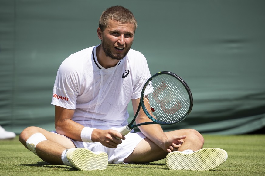 Leandro Riedi of Switzerland sits on the grass during his first round match against Oliver Tarvet of Great Britain at the All England Lawn Tennis Championships in Wimbledon, London, Monday, June 30, 2 ...