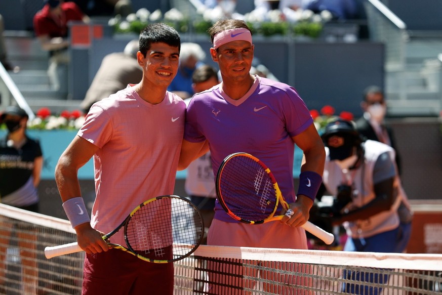 epa09179168 Rafael Nadal (R) and Carlos Alcaraz (L) of SPain pose ahead round of 32 match against Carlos Alcaraz of Spain during Mutua Madrid Open tennis tournament in Madrid, Spain, 05 May 2021. EPA/ ...
