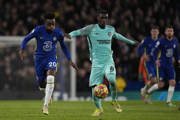 Chelsea&#039;s Callum Hudson-Odoi, left, is challenged by Brighton&#039;s Yves Bissouma during the English Premier League soccer match between Chelsea and Brighton at Stamford Bridge Stadium in London ...