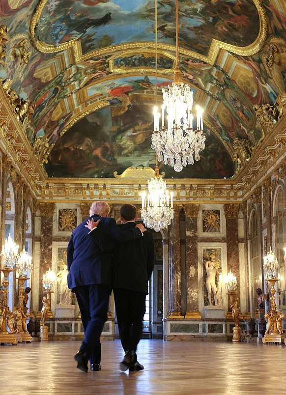 VERSAILLES, FRANCE - JUNE 17: (EDITOR'S NOTE: Alternate crop) U.S. President Donald Trump receives a tour of Chateau de Versailles from President of France Emmanuel Macron ahead of a dinner on Ju ...
