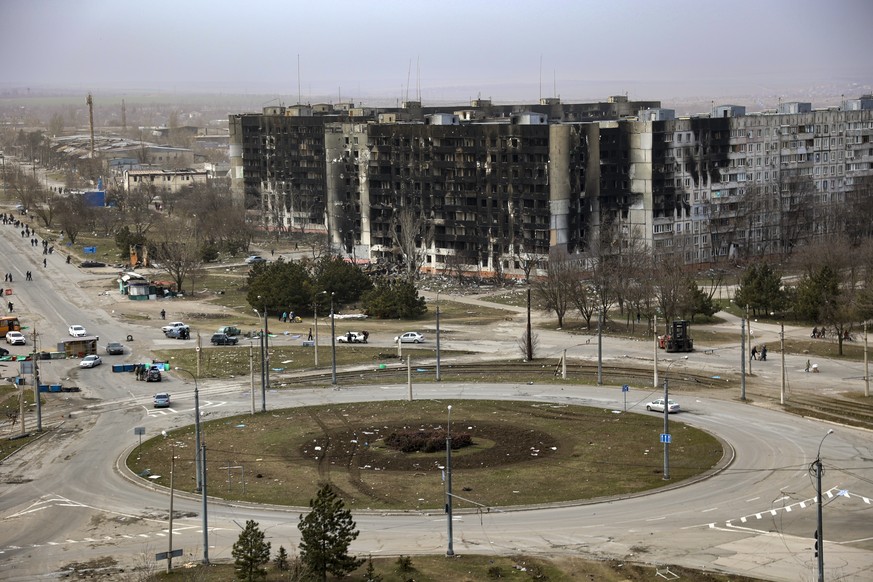 FILE - Damage is seen on apartment buildings after shelling from fighting on the outskirts of Mariupol, Ukraine, in territory under control of the separatist government of the Donetsk People&#039;s Re ...