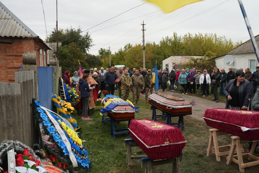 La cérémonie funéraire de la famille Lesnichenko.