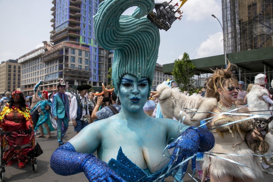 Revelers march during the Mermaid Parade in the Coney Island section of the Brooklyn borough of New York, Saturday, June 17, 2023. (AP Photo/Andres Kudacki)