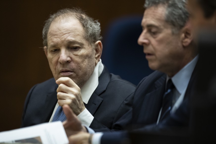 Former film producer Harvey Weinstein, left, interacts with his attorney Mark Werksman in court at the Clara Shortridge Foltz Criminal Justice Center in Los Angeles, Calif., on Tuesday, Oct. 4 2022. ( ...