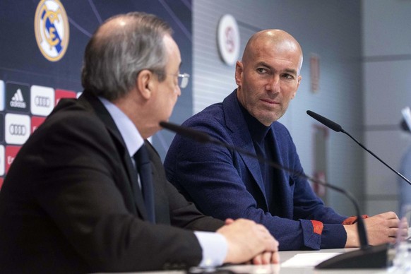 Zinedine Zidane looks at President of Real Madrid, Florentino Perez, left, during a press conference in Madrid, Spain, Thursday, May 31, 2018. Zidane quit as Real Madrid coach on Thursday, less than a ...