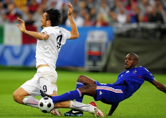 France&#039;s Eric Abidal, right, stop Italy&#039;s Luca Toni, left, during the Euro 2008 European Soccer Championship group C match between France and Italy at the Letzigrund stadium, Zurich, Switzer ...