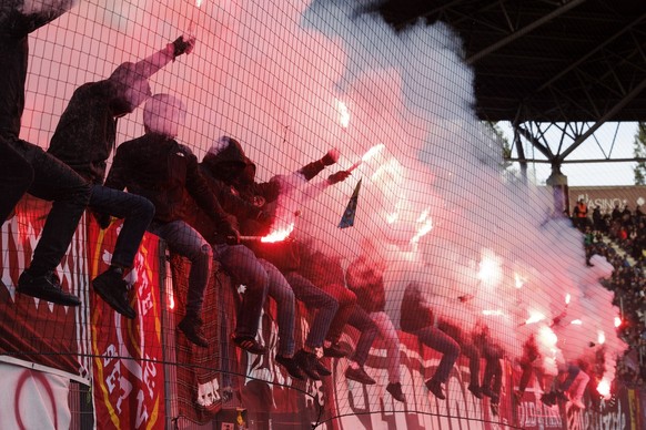 Servette&#039;s supporters light smoke flares, during the Super League soccer match of Swiss Championship between Servette FC and BSC Young Boys, at the Stade de Geneve stadium, in Geneva, Switzerland ...