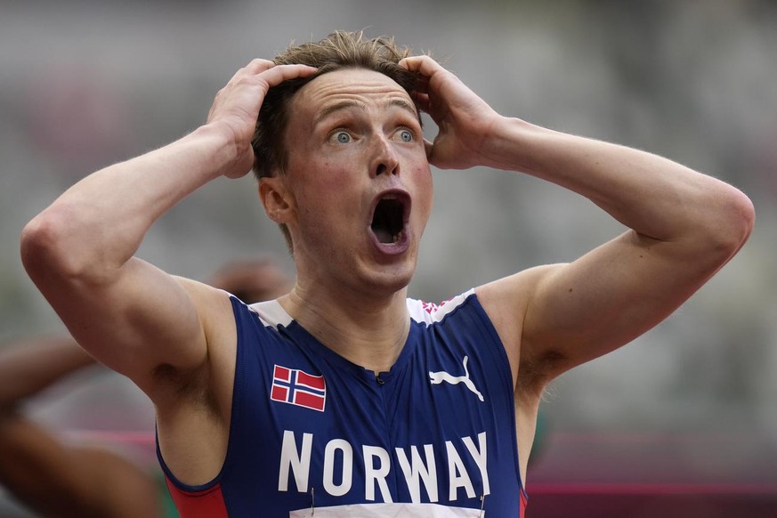 Karsten Warholm, of Norway, reacts after winning the men&#039;s 400-meter hurdles final at the 2020 Summer Olympics, Tuesday, Aug. 3, 2021, in Tokyo. (AP Photo/Petr David Josek)