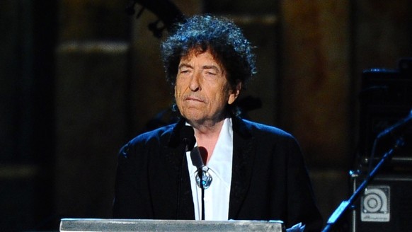 FILE - In this Feb. 6, 2015, file photo, Bob Dylan accepts the 2015 MusiCares Person of the Year award at the 2015 MusiCares Person of the Year show in Los Angeles. Dylan, who has a reputation as a re ...