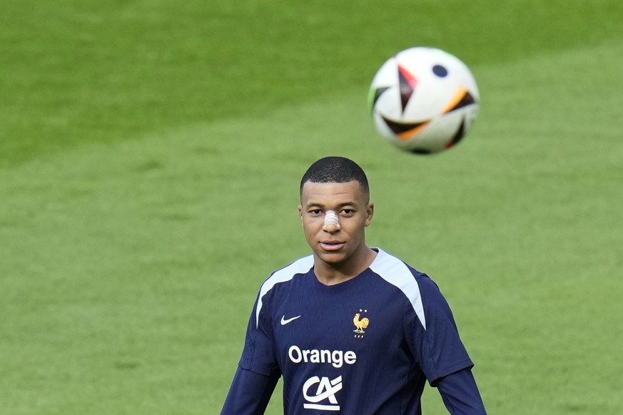 France&#039;s Kylian Mbappe eyes the ball during a training session in Paderborn, Germany, Wednesday, June 19, 2024. France will play against Netherland during their Group D soccer match at the Euro 2 ...
