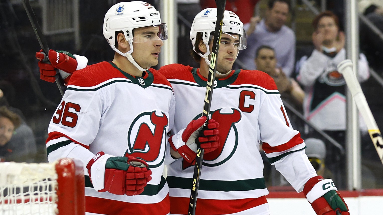 New Jersey Devils right wing Timo Meier (96) celebrates with center Nico Hischier (13) after scoring a goal against the Pittsburgh Penguins during the second period of an NHL hockey game Tuesday, Apri ...