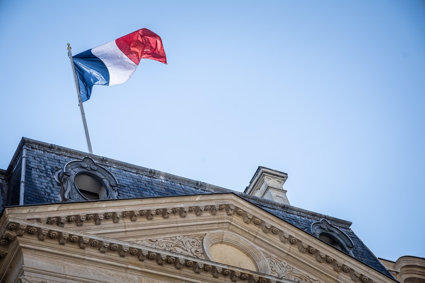 epa11567294 French flag flies over the Elysee Palace, presidency of the French Republic, in Paris, France, 27 August 2024. French President started on 23 August different consultations with leaders of ...