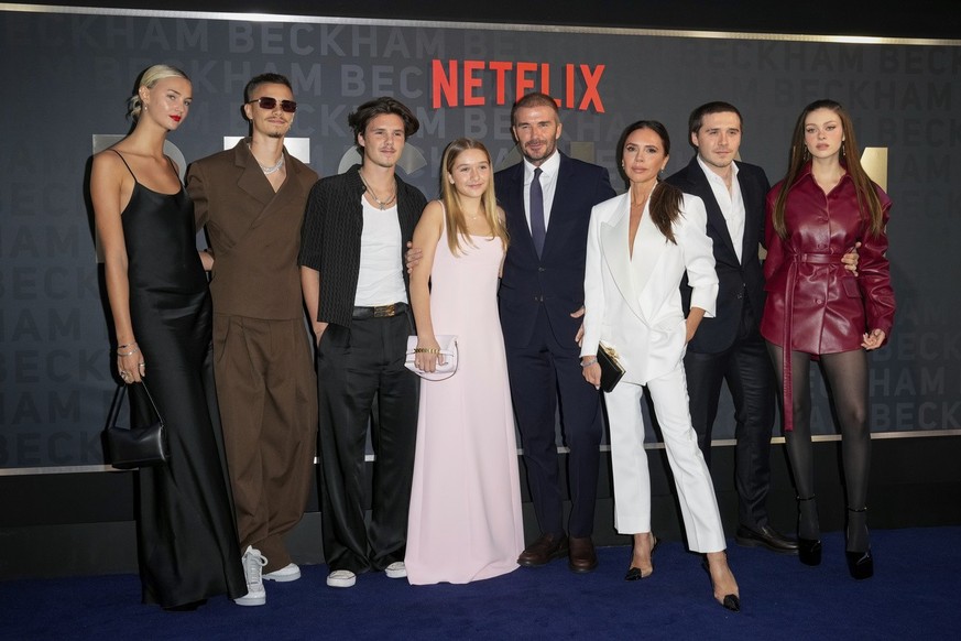 Mia Regan, from left, Romeo Beckham, Cruz Beckham, Harper Beckham, David Beckham, Victoria Beckham, Brooklyn Beckham and Nicola Peltz Beckham pose for photographers upon arrival at the premiere of the ...