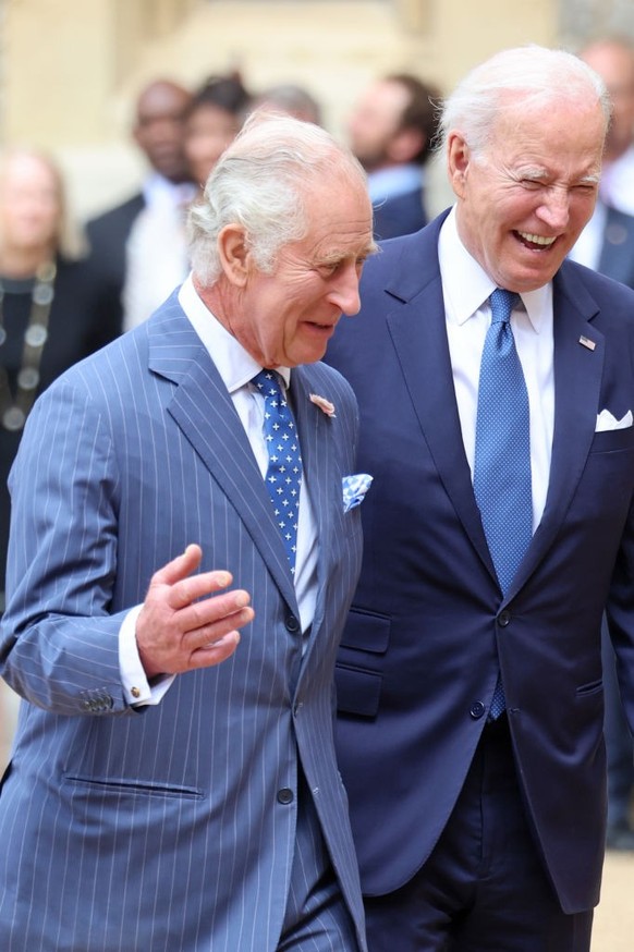 WINDSOR, ENGLAND - JULY 10: King Charles III and The President of the United States, Joe Biden laughing in the Quadrangle at Windsor Castle on July 10, 2023 in Windsor, England. The President is visit ...