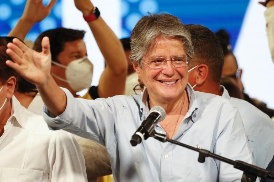 Guillermo Lasso, presidential candidate of Creating Opportunities party, CREO, speaks to supporters after a presidential runoff election at his campaign headquarters in Guayaquil, Ecuador, Sunday, Apr ...