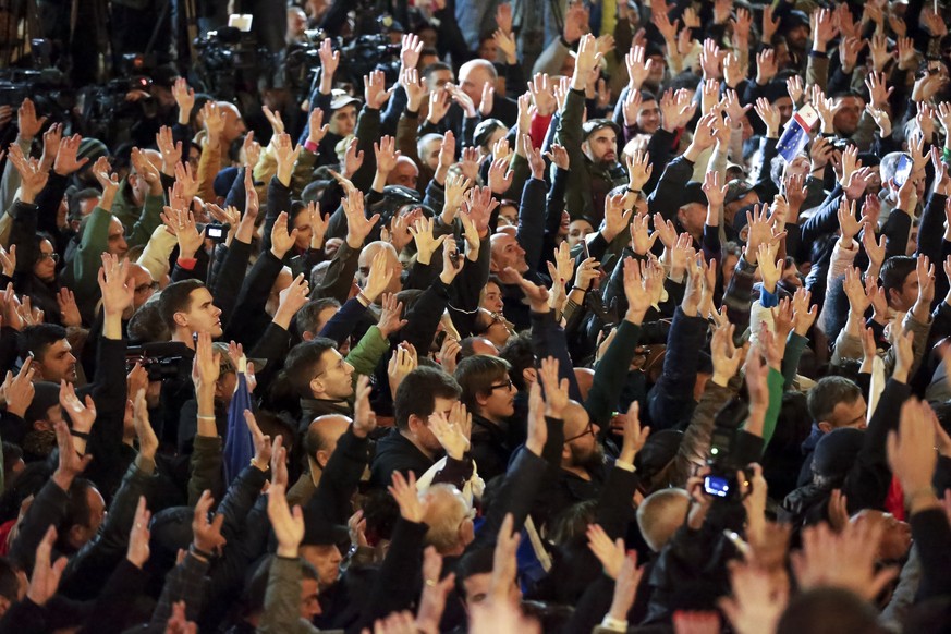 Demonstrators attend an opposition protest against the results of the parliamentary election in Tbilisi, Georgia, Monday, Oct. 28, 2024. (AP Photo/Zurab Tsertsvadze)