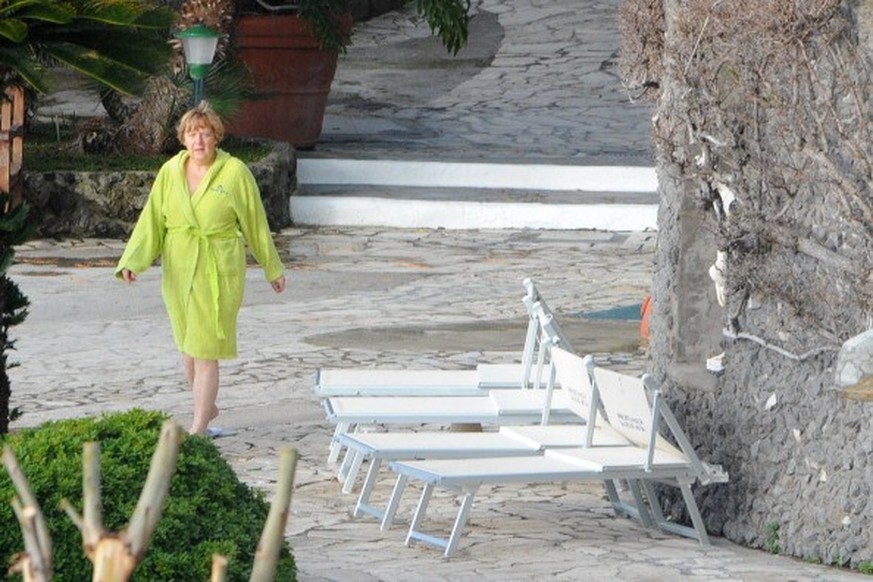German Chancellor Angela Merkel arrives to take a bath in the swimming pool of the Aphrodite Terme in the coastal town of Sant&amp;#039;Angelo d&amp;#039;Ischia on the southern Italy&amp;#039;s Island ...