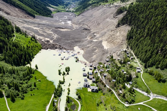 A aerial view captured one day after a massive avalanche, triggered by the collapse of the Birch Glacier, shows the destruction it caused as it swept down to the valley floor and demolishing the villa ...