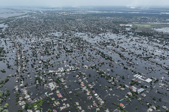 Houses are seen underwater in the flooded town of Oleshky, Ukraine, Saturday, June 10, 2023. Extensive flooding from the catastrophic destruction of the Kakhovka Dam on June 6 devastated towns along t ...