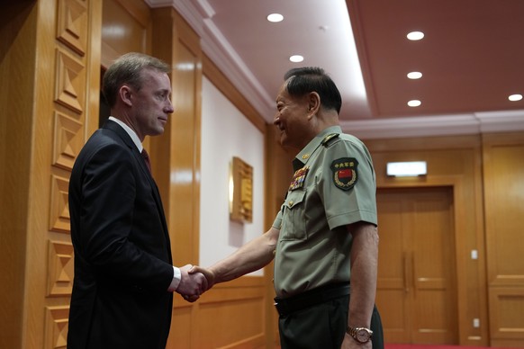 epa11570399 Zhang Youxia (R), vice chairman of the CPC Central Military Commission, shakes hands with White House national security adviser Jake Sullivan (L) before a meeting at the Bayi building in B ...
