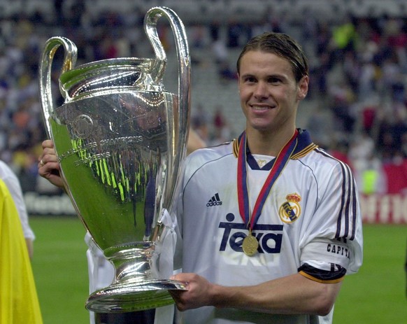 Real Madrid&#039;s captain Fernando Redondo of Argentina poses with the cup after his team beat Valencia 3-0 during their UEFA Champions&#039; League final soccer match at the Stade de France in Saint ...