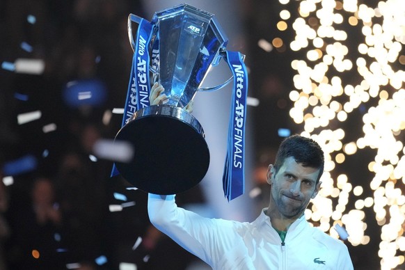 Serbia&#039;s Novak Djokovic holds his trophy after defeating Norway&#039;s Casper Ruud 7-5, 6-3, in the singles tennis final match to win the ATP World Tour Finals at the Pala Alpitour, in Turin, Ita ...