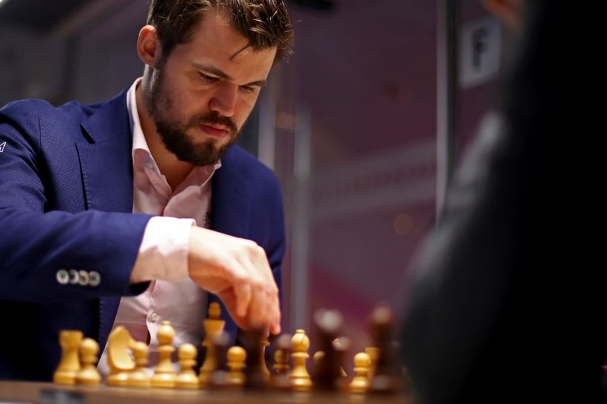 KATWIJK AAN ZEE, NETHERLANDS - JANUARY 16: Magnus Carlsen of Norway competes against Daniil Dubov of Russia during the 82nd Tata Steel Chess Tournament held at the home of PSV football club, Philips S ...