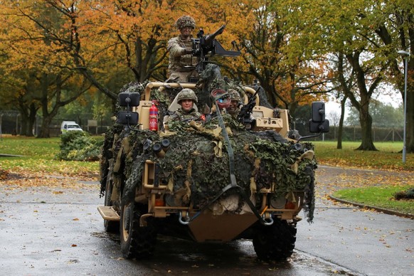 DEREHAM, ENGLAND - NOVEMBER 8: Catherine, Princess of Wales drives an armoured vehicle as she visits The Queen's Dragoon Guards Regiment for the first time as their Colonel in Chief on November 8 ...