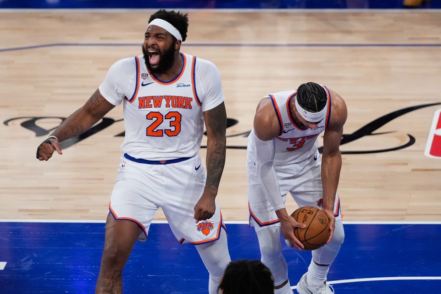 New York Knicks center Mitchell Robinson (23) and guard Josh Hart (3) celebrate after Game 4 of the NBA Finals basketball series against the San Antonio Spurs, Wednesday, June 10, 2026, in New York. ( ...