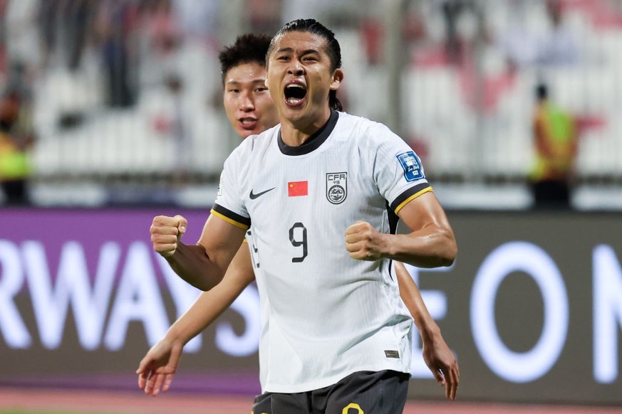 MANAMA, BAHRAIN - NOVEMBER 14: Zhang Yuning #9 of China celebrates his goal during the FIFA World Cup Asian 3rd Qualifier Group C match between Bahrain and China at the Bahrain National Stadium on Nov ...