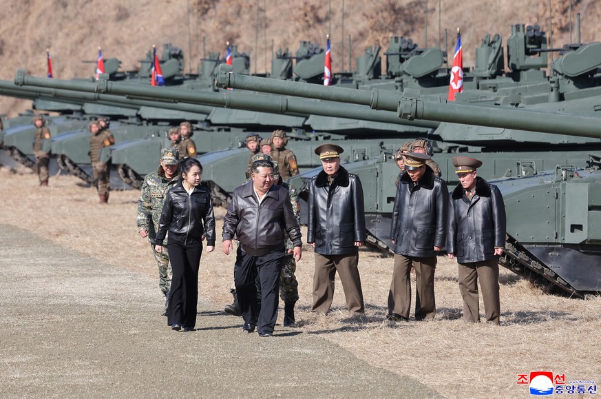 epa12835186 A photo released by the official Korean Central News Agency (KCNA) shows shows North Korean leader Kim Jong Un (2-L) and his daughter Kim Ju Ae (L) visiting the Pyongyang Training Base No. ...