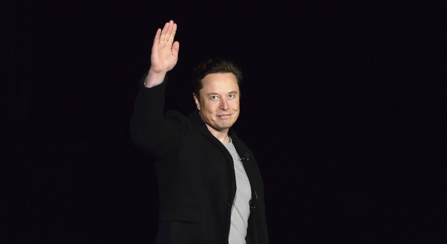 SpaceX&#039;s Elon Musk waves while providing an update on Starship, Thursday, Feb. 10, 2022, near Brownsville, Texas. Musk said that the first orbital flight of Starship--the world&#039;s most powerf ...