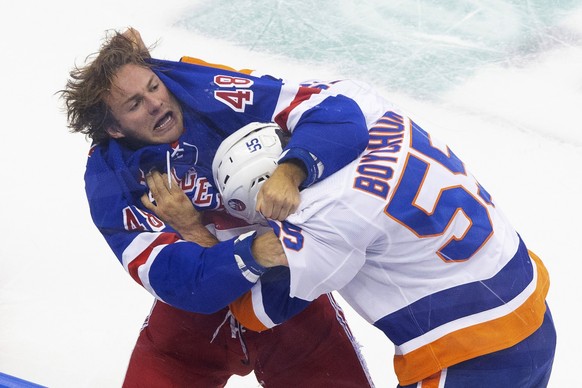 New York Rangers left wing Brendan Lemieux (48) and New York Islanders defenseman Johnny Boychuk (55) fight during the first period of an NHL hockey exhibition game in Toronto on Wednesday, July 29, 2 ...