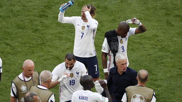 French players take a drinks break during the Euro 2020 soccer championship group F match between Hungary and France at the Ferenc Puskas stadium in Budapest, Hungary, Saturday, June 19, 2021. (AP Pho ...