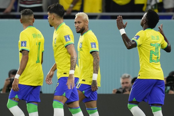 Brazil&#039;s Vinicius Junior, right, celebrates after scoring his side&#039;s opening goal besides Brazil&#039;s Neymar, second right, Brazil&#039;s Lucas Paqueta, second left, and Brazil&#039;s Raph ...