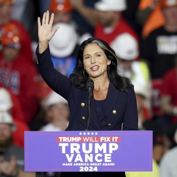 Tulsi Gabbard arrives before Republican presidential nominee former President Donald Trump speaks at a campaign rally at PPG Paints Arena, Monday, Nov. 4, 2024, in Pittsburgh. (AP Photo/Matt Freed)