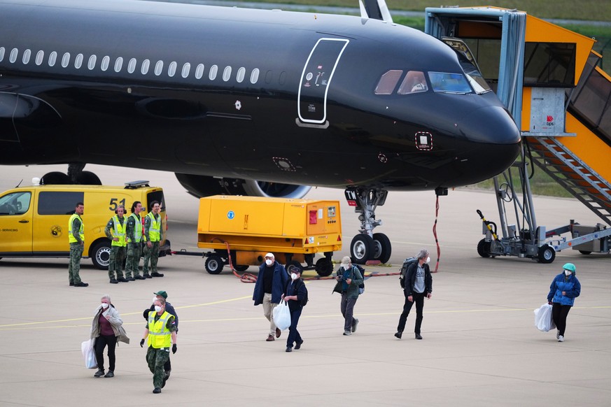 Passengers evacuated from the hantavirus-stricken cruise ship MV Hondius arrive at Eindhoven airport, Netherlands, Sunday, May 10, 2026. (AP Photo/Peter Dejong)
Netherlands Hantavirus Ship