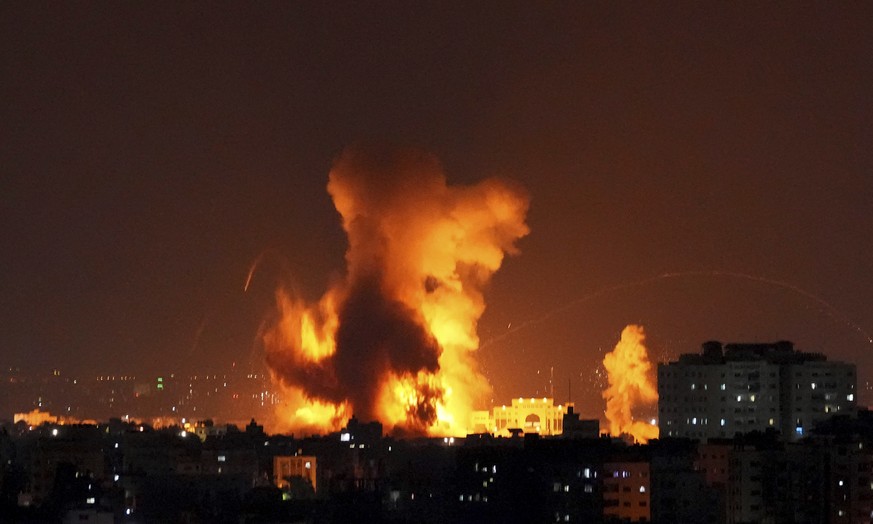 Smoke rises following Israeli airstrikes on a building in Gaza City, Friday, Aug. 5, 2022. Palestinian officials say Israeli airstrikes on Gaza have killed several people, including a senior militant, ...