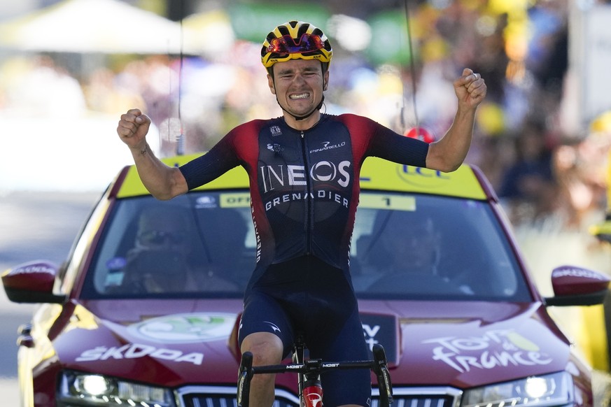 Stage winner Britain's Thomas Pidcock celebrates as he crosses the finish line of the twelfth stage of the Tour de France cycling race over 165.5 kilometers (102.8 miles) with start in Briancon a ...