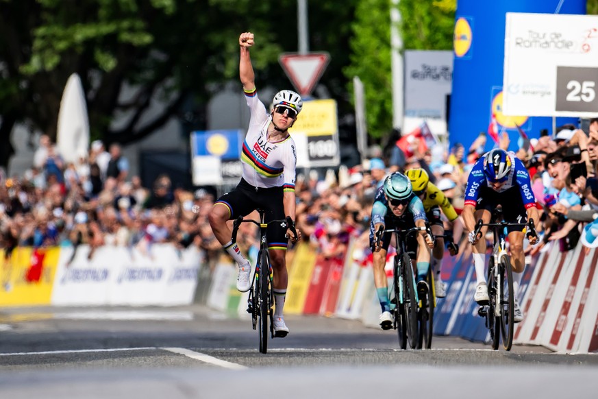 Slovenia's Tadej Pogacar celebrates winning the first stage, a 170,6 km race around Martigny, at the 79th Tour de Romandie cycling race, in Saint-Maurice, Switzerland, Wednesday, April 29, 2026.  ...