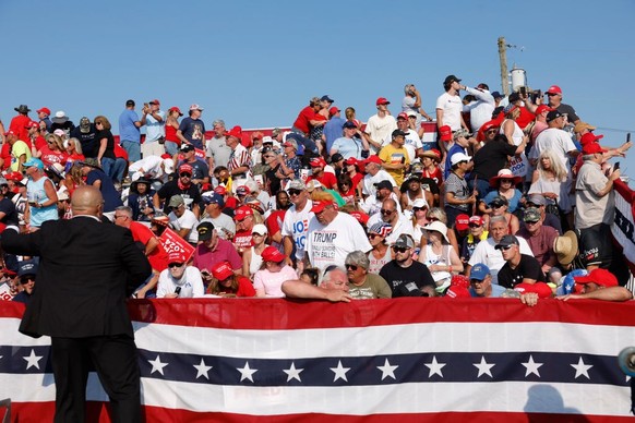 BUTLER, PENNSYLVANIA - JULY 13: The crowd reacts after shots were fired at republican presidential candidate former President Donald Trump's rally on July 13, 2024 in Butler, Pennsylvania. Butler ...