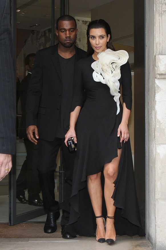 PARIS, FRANCE - JULY 03: Singer Kanye West and Kim Kardashian are seen leaving the Celine store on July 3, 2012 in Paris, France. (Photo by Marc Piasecki/FilmMagic)