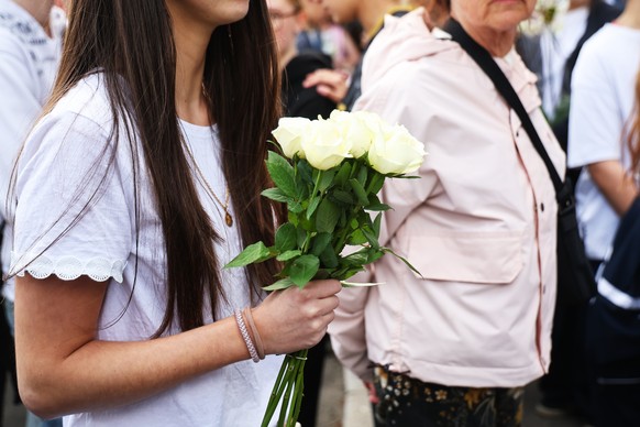 epa12054243 Students arrive with flowers for a gathering the Notre-Dame de Toutes-Aides high school, where a student stabbed several teenagers the day before, in Nantes, France, 25 April 2025. On 24 A ...
