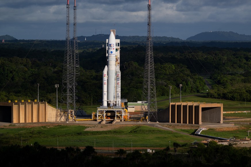 FILE - This photo provided by the European Space Agency shows an Ariane 5 rocket carrying the Jupiter Icy Moons Explorer, Juice, spacecraft on a launch pad at Europe&#039;s Spaceport in Kourou, French ...
