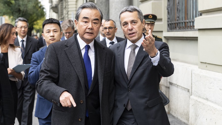 Swiss Foreign minister, Federal Councillor Ignazio Cassis, right, walks to a joint press conference with his guest Wang Yi, Foreign Minister of the PeopleÕs Republic of China, staying on an official w ...