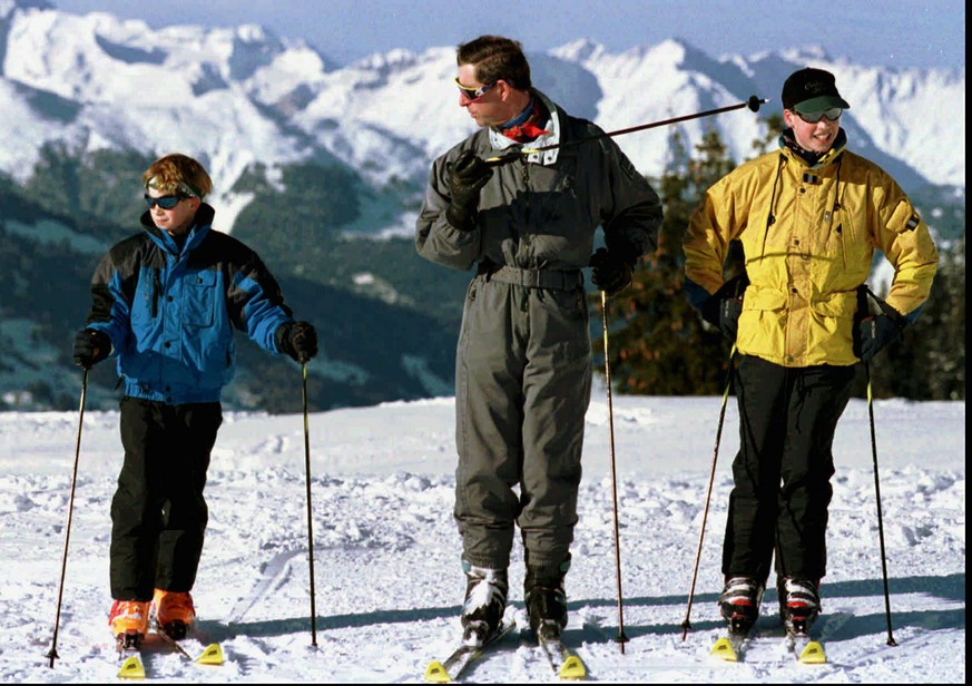 FILE - In this Tuesday, Jan. 2, 1996 file photo, Britain&#039;s Prince Charles leads his sons Harry, left, and William onto the slopes above the alpine skiing resort of Klosters in Switzerland on the  ...