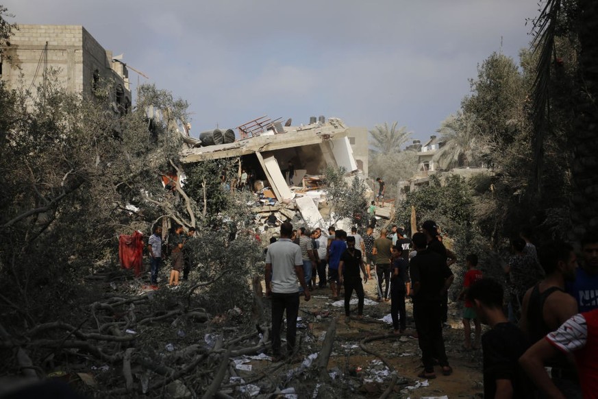 GAZA CITY, GAZA - NOVEMBER 02: Palestinians conduct a search and rescue operation after the attack of the Israeli army at Maghazi refugee camp in Gaza City, Gaza on November 02, 2023. (Photo by Ashraf ...