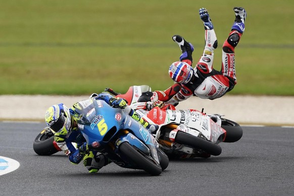 epa07952561 Thai rider Somkiat Chantra (R) of the Idemitsu Honda Team Asia crashes with Swiss rider Dominique Aegeter of the MV Agusta Temporary Forward Racing team during the Moto 2 race on day three ...