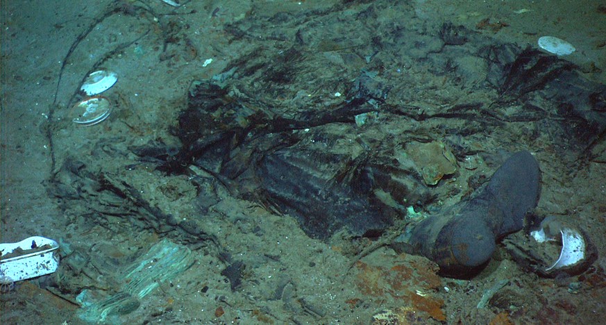 FILE - This 2004 photo provided by the Institute for Exploration, Center for Archaeological Oceanography/University of Rhode Island/NOAA Office of Ocean Exploration, shows the remains of a coat and bo ...